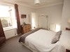 King size bedroom with flat screen TV