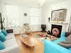 Communal Living Area with T.V, music center and a range of Books